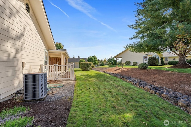 view of yard with central AC unit