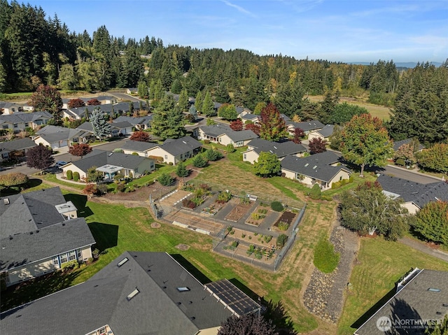 bird's eye view featuring a residential view and a view of trees