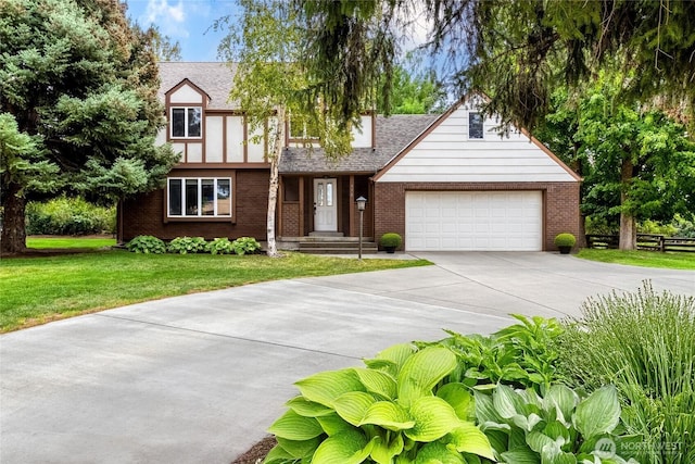 958 Abbott Rd, Walla Walla, WA 99362 - english style home with a garage, a front lawn, roof with shingles, brick siding, and driveway