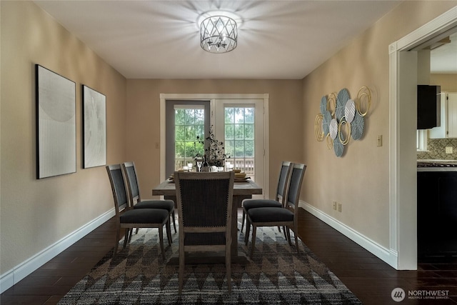 958 Abbott Rd, Walla Walla, WA 99362 - dining space with baseboards, dark wood-type flooring, and a notable chandelier