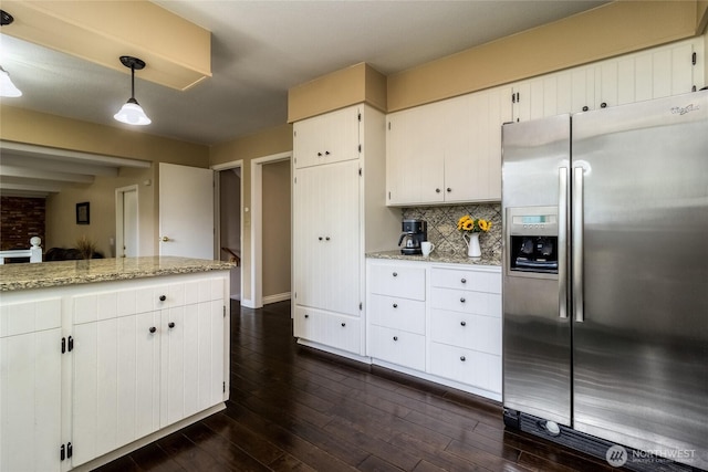 958 Abbott Rd, Walla Walla, WA 99362 - kitchen featuring white cabinets, hanging light fixtures, decorative backsplash, dark wood-type flooring, and stainless steel refrigerator with ice dispenser