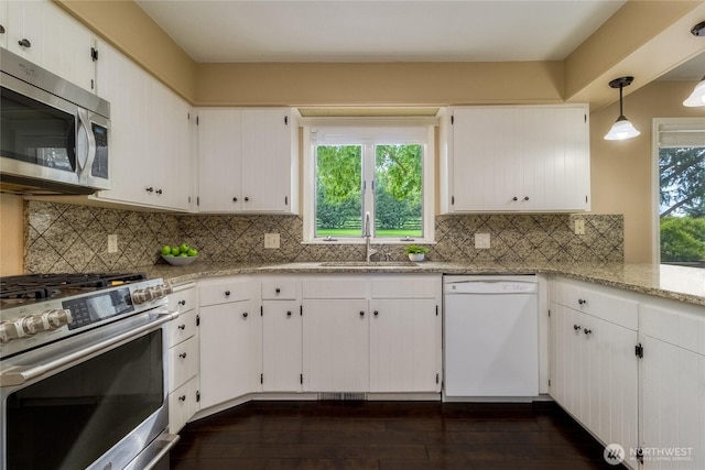 958 Abbott Rd, Walla Walla, WA 99362 - kitchen with white cabinets, light stone countertops, a sink, stainless steel appliances, and dark wood-style floors