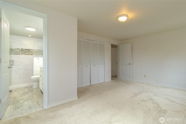 958 Abbott Rd, Walla Walla, WA 99362 - unfurnished bedroom featuring baseboards, light carpet, ensuite bathroom, and a closet