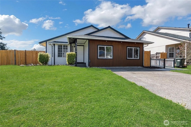 22516 45th Ave E, Spanaway, WA 98387 - view of front of home featuring fence and a front lawn