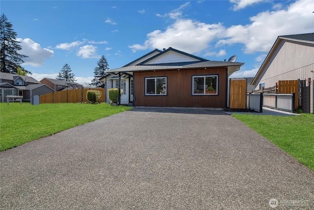 22516 45th Ave E, Spanaway, WA 98387 - view of front of home with fence, driveway, and a front yard
