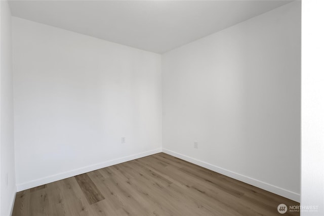 22516 45th Ave E, Spanaway, WA 98387 - unfurnished room featuring baseboards and wood finished floors