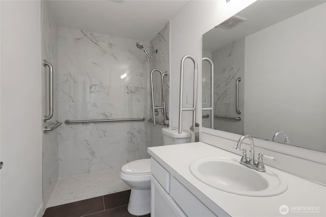 22516 45th Ave E, Spanaway, WA 98387 - full bathroom featuring a marble finish shower, vanity, and toilet