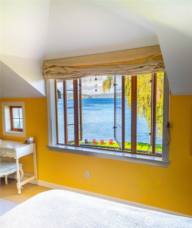 8314 Island Dr S, Seattle, WA 98118 - carpeted bedroom featuring baseboards, a water view, and vaulted ceiling