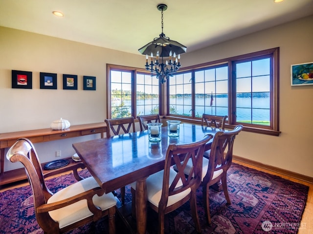 8314 Island Dr S, Seattle, WA 98118 - dining space featuring baseboards, a water view, recessed lighting, and a notable chandelier