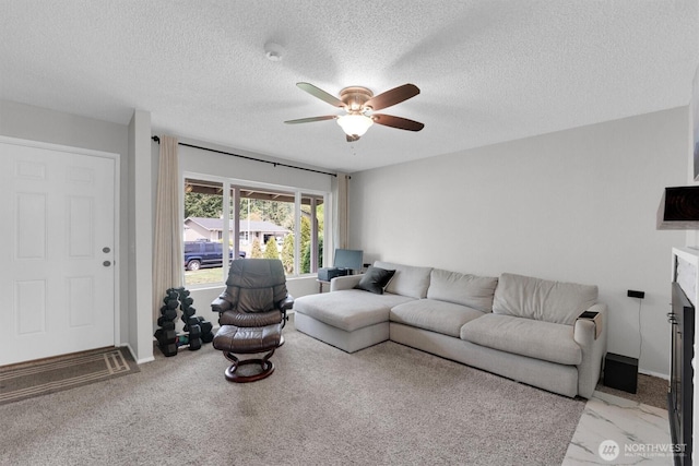 1718 33rd St SE, Auburn, WA 98002 - living area featuring a ceiling fan, a textured ceiling, a fireplace, and baseboards