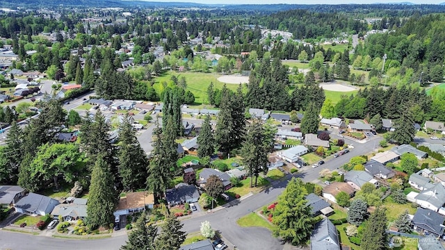 1718 33rd St SE, Auburn, WA 98002 - aerial view of property and surrounding area featuring nearby suburban area and a forest
