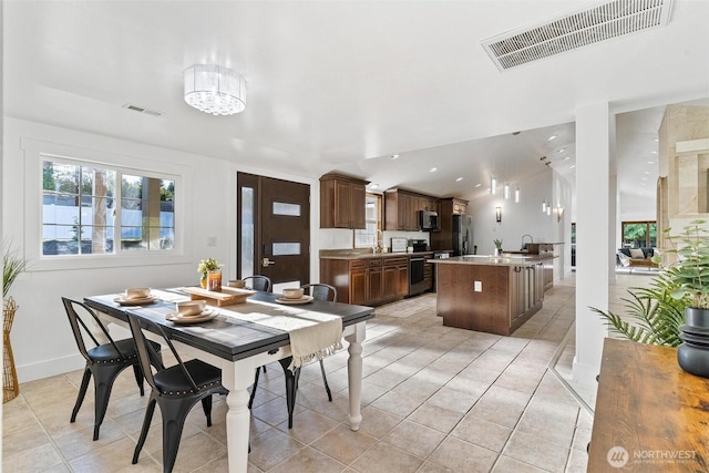 dining room with light tile patterned flooring, baseboards, visible vents, and recessed lighting