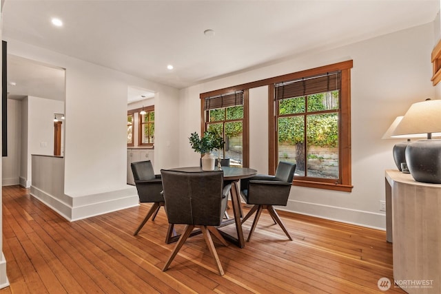 dining area with recessed lighting, baseboards, and light wood-style floors
