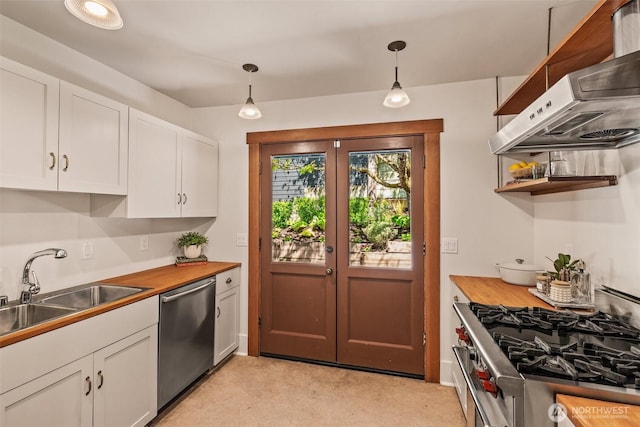 kitchen featuring white cabinets, appliances with stainless steel finishes, a sink, french doors, and under cabinet range hood