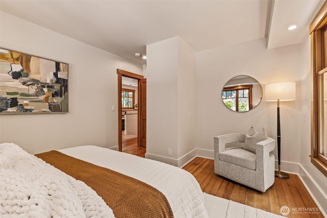 bedroom with recessed lighting, baseboards, and hardwood / wood-style flooring