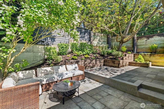 view of patio / terrace with a fenced backyard and outdoor lounge area