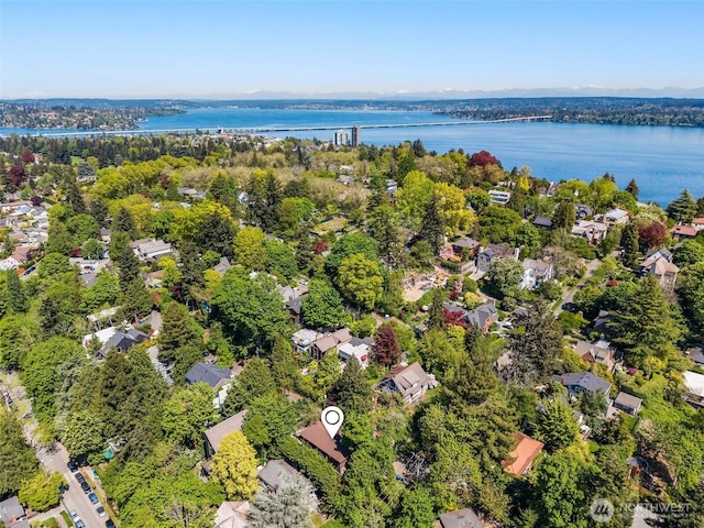 drone / aerial view with a water view and a residential view