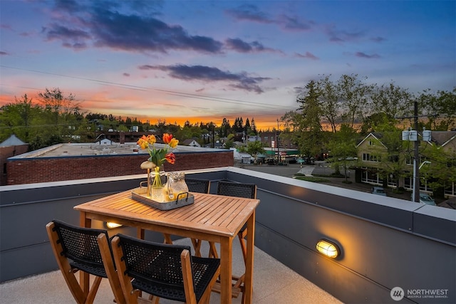 view of balcony at dusk