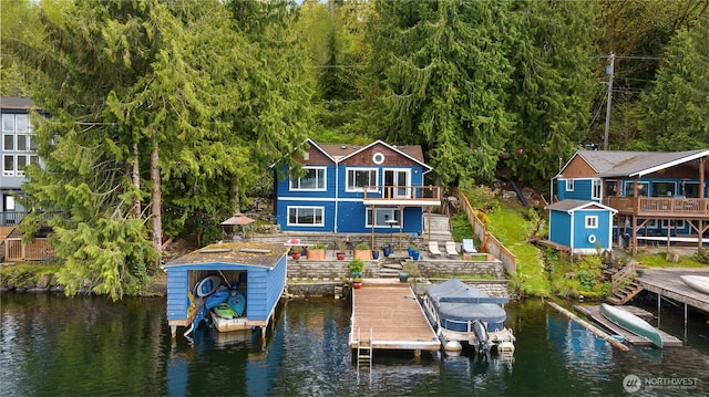 23821 S Lake Roesiger Rd, Snohomish, WA 98290 - view of dock featuring boat lift, a water view, stairs, and a balcony