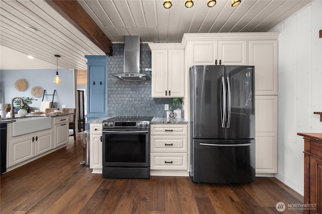 23821 S Lake Roesiger Rd, Snohomish, WA 98290 - kitchen featuring light stone countertops, wall chimney range hood, white cabinets, a sink, and appliances with stainless steel finishes