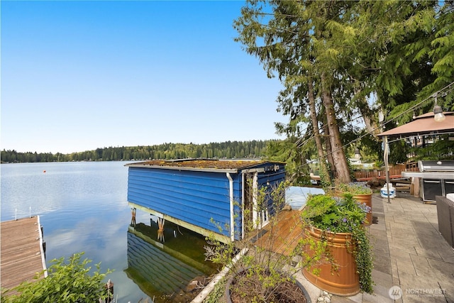 23821 S Lake Roesiger Rd, Snohomish, WA 98290 - view of dock featuring a view of trees, a water view, a gazebo, and a patio area