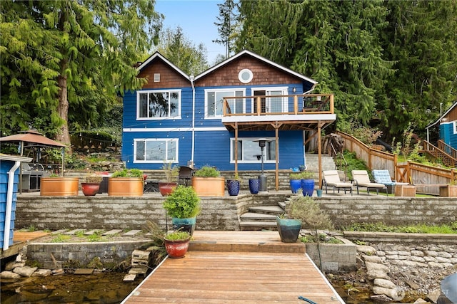 23821 S Lake Roesiger Rd, Snohomish, WA 98290 - rear view of house featuring fence and a wooden deck