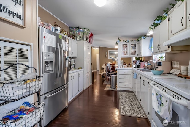 kitchen featuring a sink, stainless steel fridge with ice dispenser, white cabinetry, and light countertops