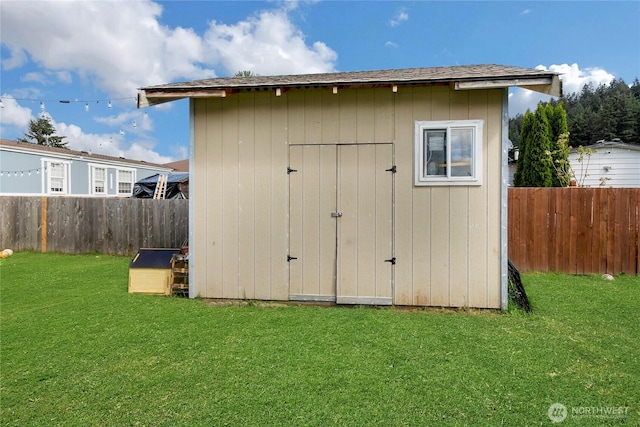view of shed featuring a fenced backyard
