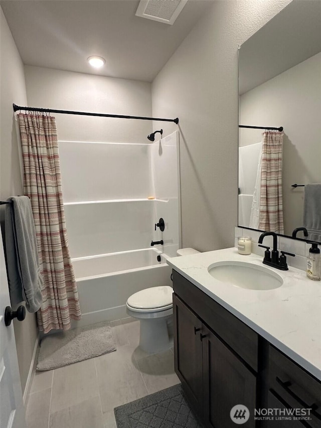 bathroom featuring tile patterned flooring, shower / tub combo with curtain, vanity, toilet, and visible vents