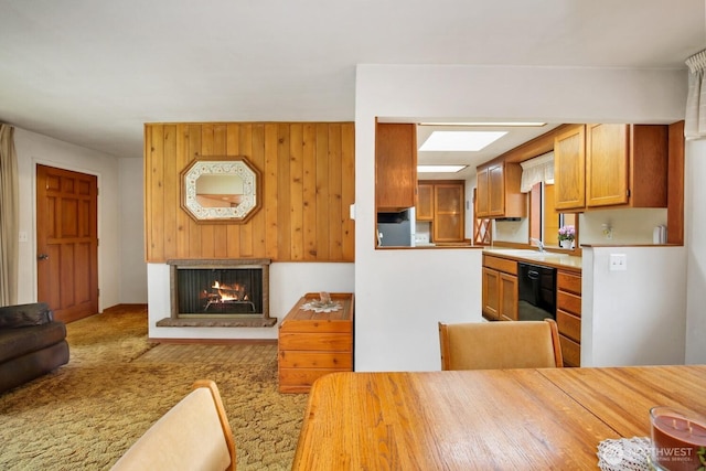 4995 Johnson St NW, Bremerton, WA 98311 - carpeted dining space featuring a brick fireplace and a sink