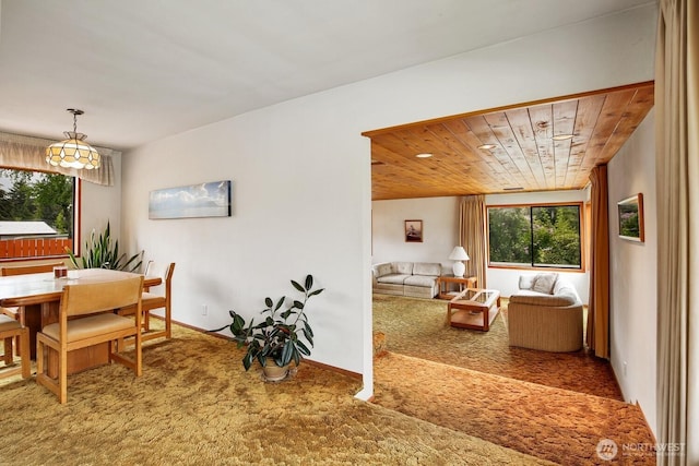 4995 Johnson St NW, Bremerton, WA 98311 - dining space featuring carpet floors, healthy amount of natural light, and wooden ceiling