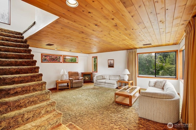 4995 Johnson St NW, Bremerton, WA 98311 - living room featuring wood ceiling, stairway, carpet, and a lit fireplace