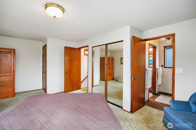 4995 Johnson St NW, Bremerton, WA 98311 - bedroom with light colored carpet, a closet, and baseboards
