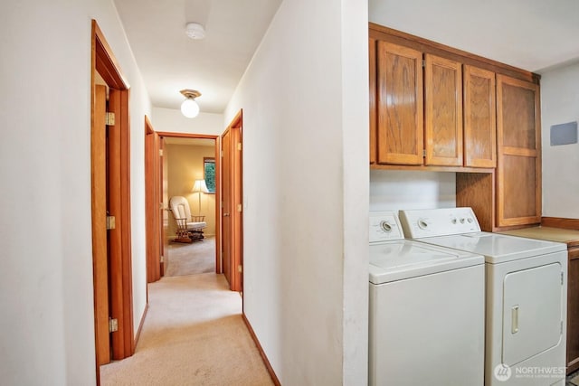 4995 Johnson St NW, Bremerton, WA 98311 - laundry area featuring cabinet space, separate washer and dryer, and light carpet