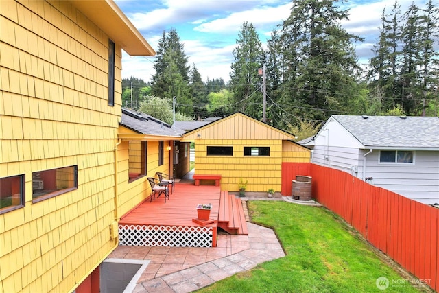 4995 Johnson St NW, Bremerton, WA 98311 - view of yard featuring a wooden deck, a patio area, and view of scattered trees