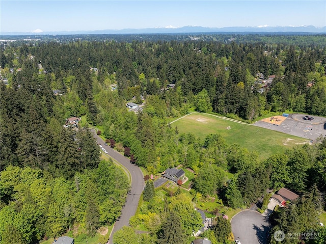 bird's eye view featuring a forest view