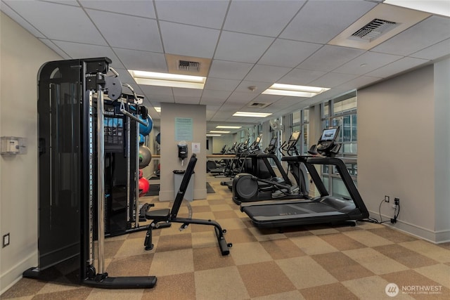 819 Virginia Unit 1104, Seattle, WA 98101 - exercise room featuring baseboards and a paneled ceiling
