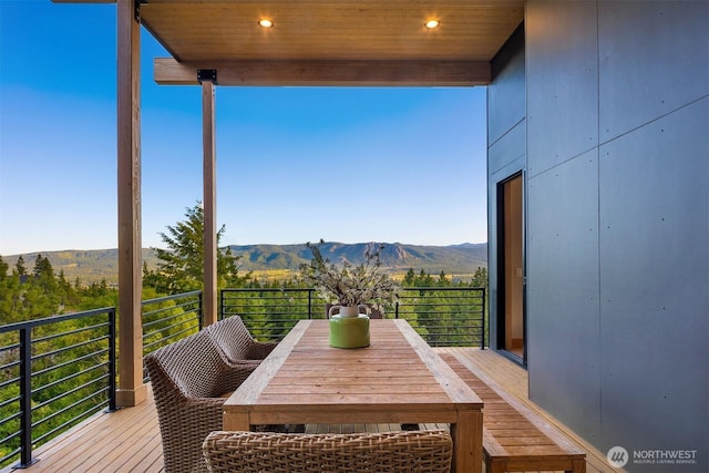 exterior space with outdoor dining area and a mountain view