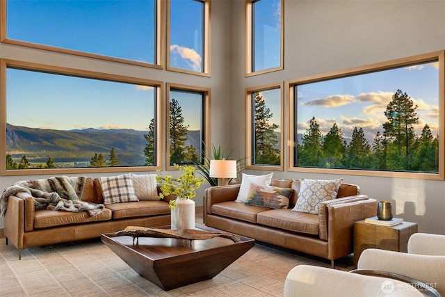 sunroom / solarium featuring a mountain view