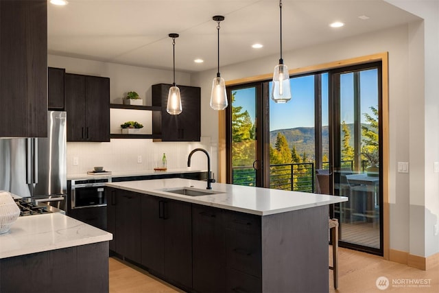 kitchen with open shelves, a sink, freestanding refrigerator, recessed lighting, and backsplash