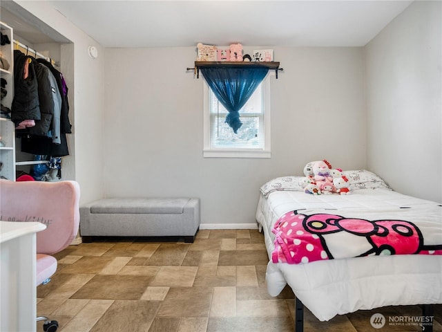 bedroom featuring baseboards