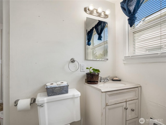 bathroom with toilet and vanity