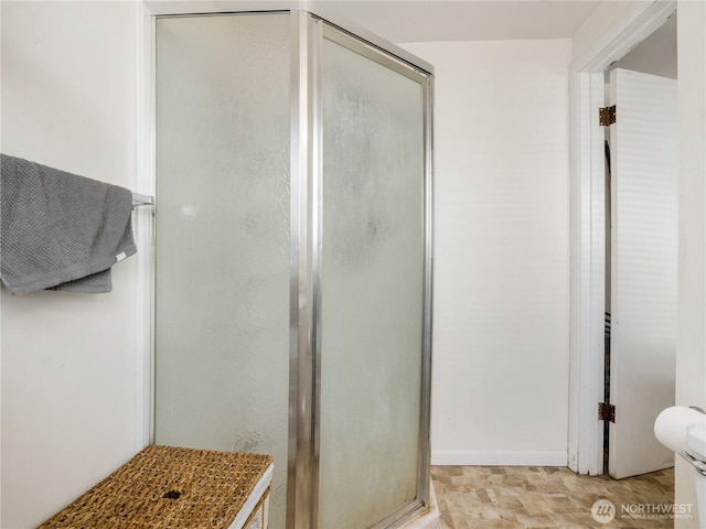full bathroom with a shower stall