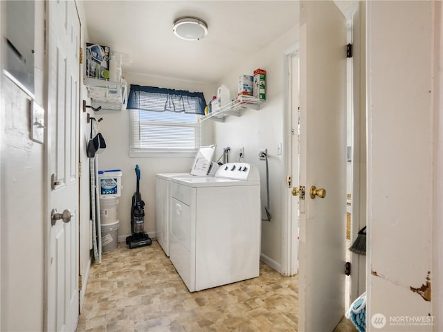 laundry area featuring laundry area and washer and clothes dryer