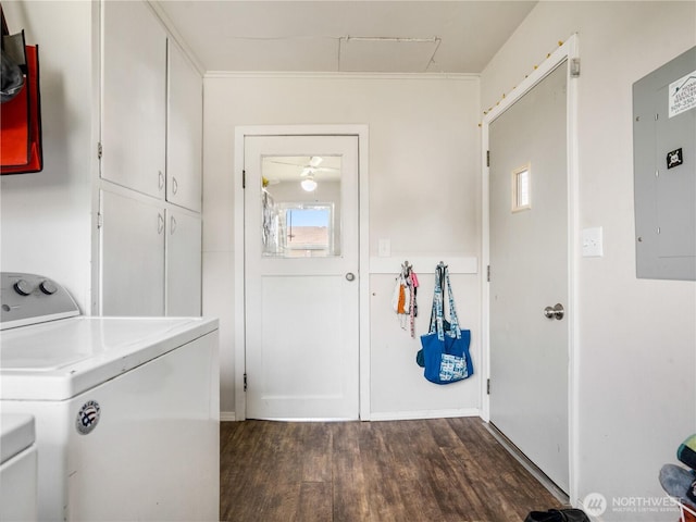 clothes washing area featuring washer and dryer, dark wood-type flooring, electric panel, cabinet space, and a wealth of natural light