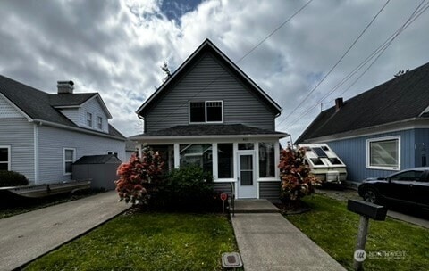 bungalow-style house with a front yard