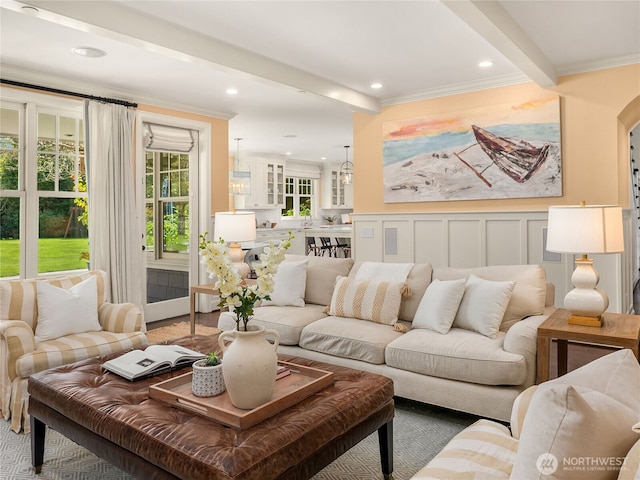 living room featuring crown molding and recessed lighting