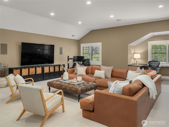 living area with recessed lighting, a healthy amount of sunlight, and light carpet