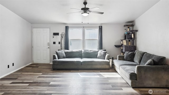 living room featuring a ceiling fan, wood finished floors, and baseboards