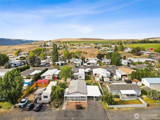 aerial view of residential area with a mountain backdrop